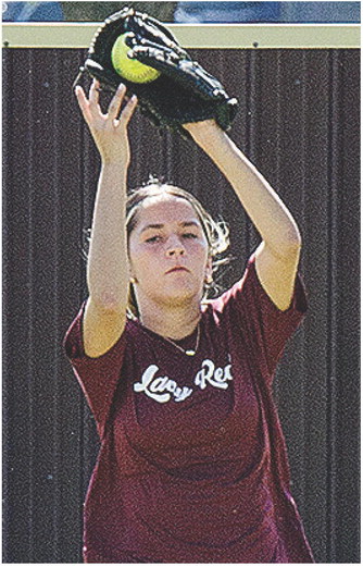 Emily De La Rosa secures the ball in her glove during softball practice at the high school softball field. CDN |Sam Goodwyn