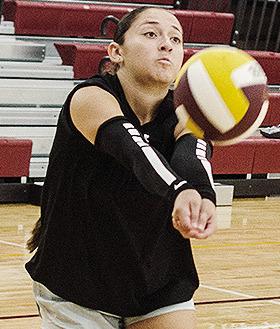 Clinton’s Aaliyah Lopez returns the ball back over the net during practice in the practice gym. CDN | Sam Goodwyn