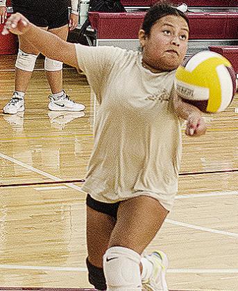 Nailleli Ramos uses one arm to send the ball back over the net during practice. CDN | Sam Goodwyn