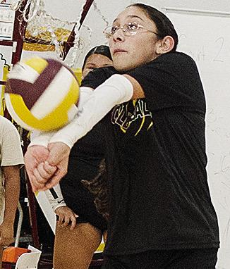 Jocelyn Lagunas keeps her arms together as she hits the ball back during volleyball practice in the practice gym. CDN | Sam Goodwyn