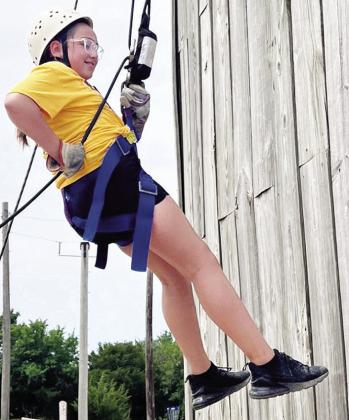Paeton Eaton repels down a wall during a field trip to Crowder Lake with Summer Playground. CDN | Courtesy photo