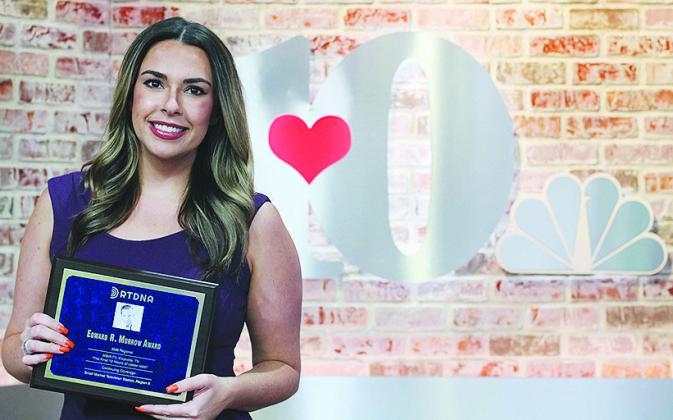 Shea Smith holds the Edward R. Murrow Award at the WBIR studio. CDN | Courtesy photo