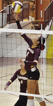 No. 2 Ella Redshin sends the ball back over the net while No. 4 Ayleen Cervantes waits to help during Clinton’s game against Cache Thursday at home. CDN | Sam Goodwyn