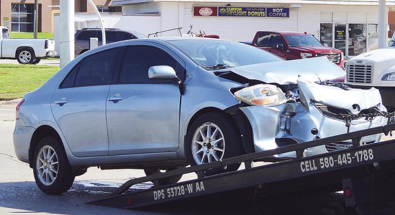 A wrecker pulls up a car after being involved in a two-vehicle collision at approximately 3 p.m. Tuesday at the intersection of Gary Boulevard and Modelle Avenue. It appeared no one was seriously injured. CDN | Micah Ashcraft