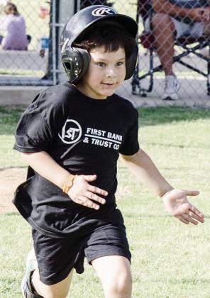 Lincoln Adney hustles to first base during his Noon Lion’s Club T-Ball game at Acme Brick Park. CDN |Sam Goodwyn