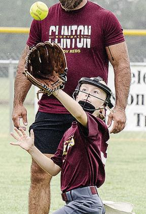 Vivien Salinas focuses on catching the ball prior to Clinton’s softball game in the OK Kids 8U Softball State Tournament at Schumacher Fields at Acme Brick Park. CDN |Sam Goodwyn