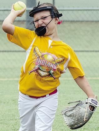 Kimber Lacy throws the ball during warmups prior to Arapaho- Butler’s first-round game in the OK Kids 8U Softball State Tournament at Acme Brick Park. CDN |Sam Goodwyn