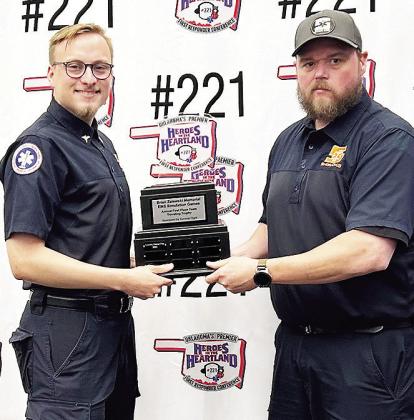 Grant Spillman, left, and James Livingston with Sinor EMS hold their trophy after getting first overall at the SIM Games held at the OKC Convention Center. CDN | Courtesy photo