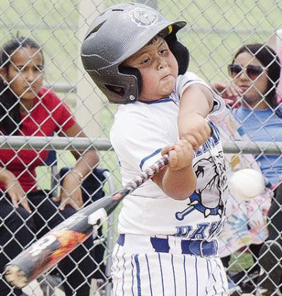 Damian Puentes of the Altus Diamond Dawgs swings mightily at the ball during the first game of the OK Kids 8U Baseball State Tournament Thursday at Schumacher Fields at Acme Brick Park. CDN | Sam Goodwyn