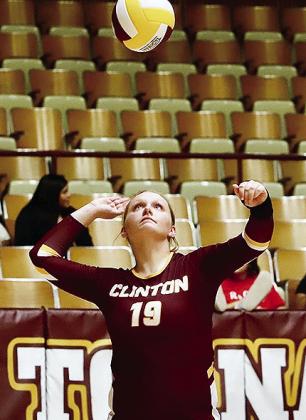 Clinton’s Sami Hammans focuses on the ball as she prepares to serve it during the Lady Reds’ Senior Night match against Blair. CDN |Kerri Staggs