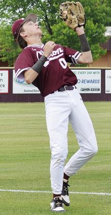 Clinton’s Grant Serfoss catches the ball for the out during the Reds’ game. CDN | Sam Goodwyn