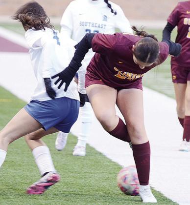 Clinton’s Aliyah Lopez, right, steals the ball from the Southeast player during the Lady Reds’ season-opening win Tuesday over the Lady Spartans in the Tornado Bowl. CDN | Sam Goodwyn
