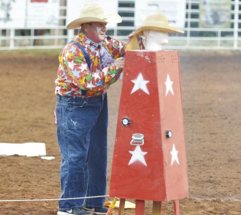 Greg Harrell performs in a bit as the rodeo clown during the Clinton Round-Up Rodeo.