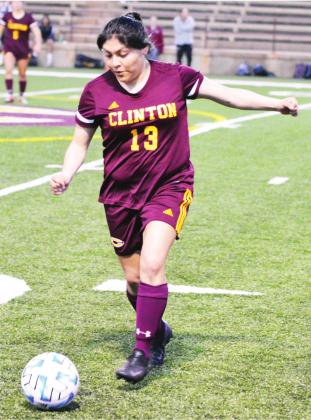 CDN | Collin Wieder Clinton senior defender Elizabeth Trejo dribbles the ball, before clearing it off the back line against Putnam City North.