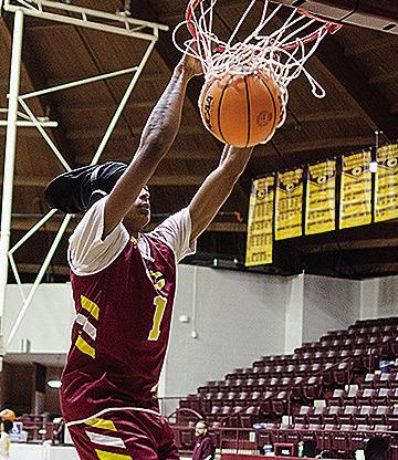 Clinton’s DJ Lister dunks the ball as he warms up for practice in the Tornado Dome. CDN | Sam Goodwyn