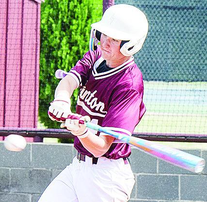 Clinton’s Jeter King swings mightily at the ball as he records a hit during the Reds’ home game Wednesday against Elk City. CDN | Sam Goodwyn
