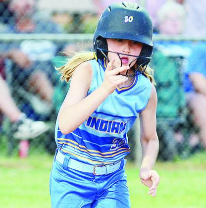 A-B’s PaisleeAnn Simon holds on to her helmet as she hustles to first in the Lady Indians’ win over Lindsay to open the OK Kids 8U Softball State Tournament. CDN | Sam Goodwyn