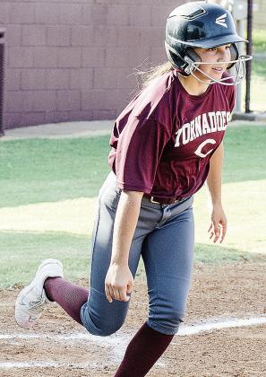 Brielle Villalpando hustles out of the box as she heads to first during Clinton’s scrimmage. CDN |Sam Goodwyn