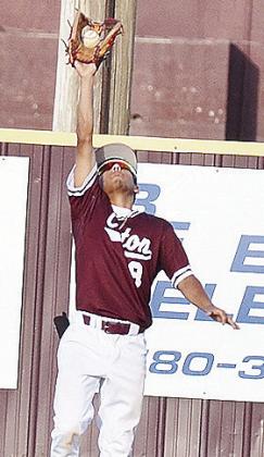 Clinton’s Azreal Fierros jumps up to make the catch during the Reds’ home win Tuesday over the neighboring Arapaho- Butler Indians to kick off the summer schedule. CDN | Sam Goodwyn