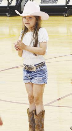 Alexus Vazquez claps to the music during the square dancing event Thursday at Nance Elementary. CDN | Sam Goodwyn
