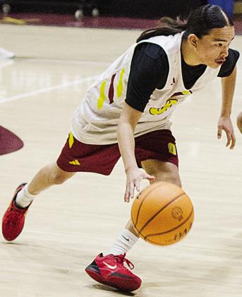 Clinton’s Dyson Ellis drives to the court during the Reds’ practice in the Tornado Dome. CDN |Sam Goodwyn