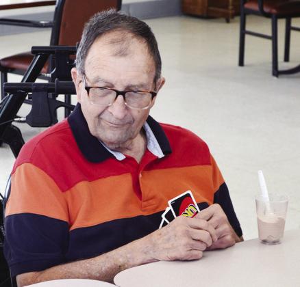 Mack Miller waits for his turn during Uno and Milkshakes at River Valley Therapy Center.