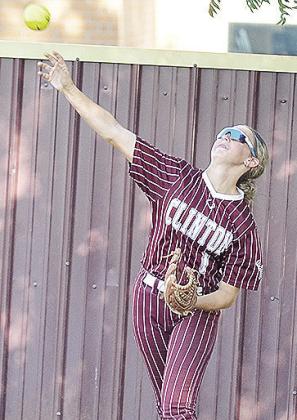 Clinton’s Olivia Cates hurls the ball in from right field during the Lady Reds’ home win Thursday over the OKC Lady Broncos on Senior Night. CDN | Sam Goodwyn