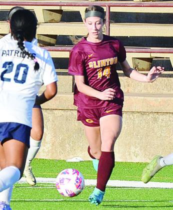 No. 14 Zoe Howell drives the ball toward a Putnam City West defender during Clinton’s home win over the Lady Patriots in the Tornado Bowl. CDN |Sam Goodwyn