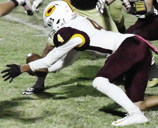 No. 4 Vicente Gutierrez jumps on the loose ball to give Clinton possession during the Red Tornadoes’ road win Thursday over Woodward. CDN | John Kinsey