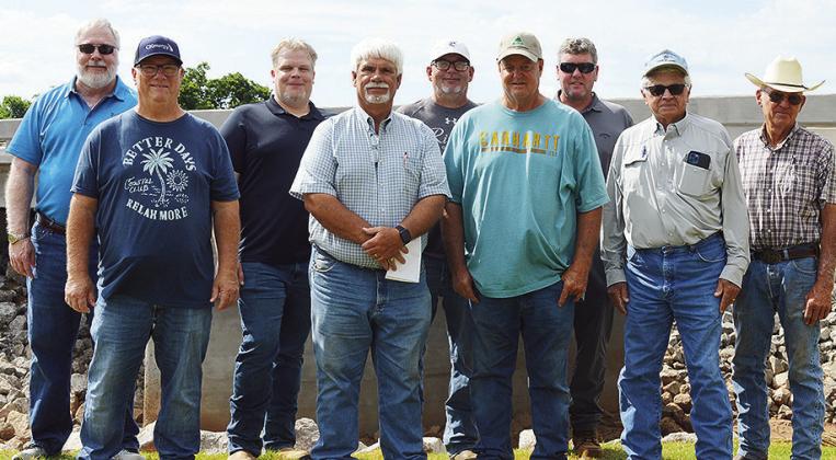 Front row from left, Buddy Vogt, Dist. 1 Commissioner Wade Anders, Davey Sewell, Terry Jones; back row, CED-7 Executive Director John Northup, Jeremy Andrews, Rodney Cabaniss, CED-7 Utilities Coordinator Clint Mahanay, and Jack Carpenter, stand in front o