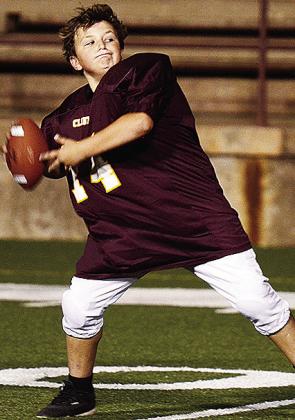Jaxen Patton tosses the football prior to his Clinton NEXT League game in the Tornado Bowl. CDN |Sam Goodwyn