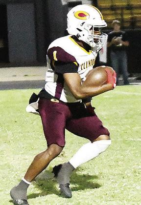 No. 1 Derren Hester carries the ball in Clinton’s road game against Woodward. CDN |John Kinsey