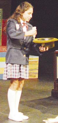 Leah Fanshier plays the titular lead role as she plays a prank on her character’s father during the Southwest Playhouse’s production of “Matilda.” CDN | Micah Ashcraft