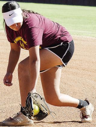 Clinton’s Jaeda Blackeagle fields the ball during preseason practice Tuesday at the softball field at the high school. CDN | Sam Goodwyn