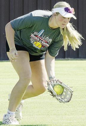 Rhylee Rodebush squeezes the ball in her glove during preseason practice Tuesday at the high school softball field. CDN | Sam Goodwyn