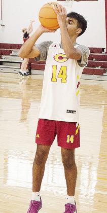 No. 14 Joseph Nava lines up to shoot the free throw during practice in the practice gym. CDN | Sam Goodwyn
