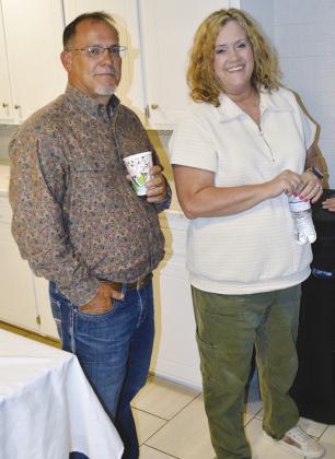 Sid Smith, left, and Julie Caldwell visit with folks at the Chamber of Commerce Morning Mixer at Lee Hometown Funeral Home. CDN | Christian Jacobsen