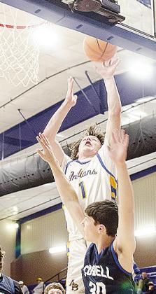 No. 1 Rylan Moore lays the ball up over the Cordell defender in Arapaho-Butler’s first-round win over the Blue Devils in the Western Equipment Classic. CDN | Sam Goodwyn