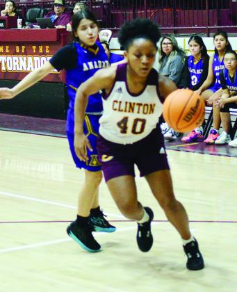 Clinton’s Rica Stennis looks for an opening to pass.