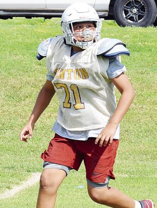 Clinton’s Damars Ellis runs a route before catching the ball during practice at the middle school. CDN | Sam Goodwyn