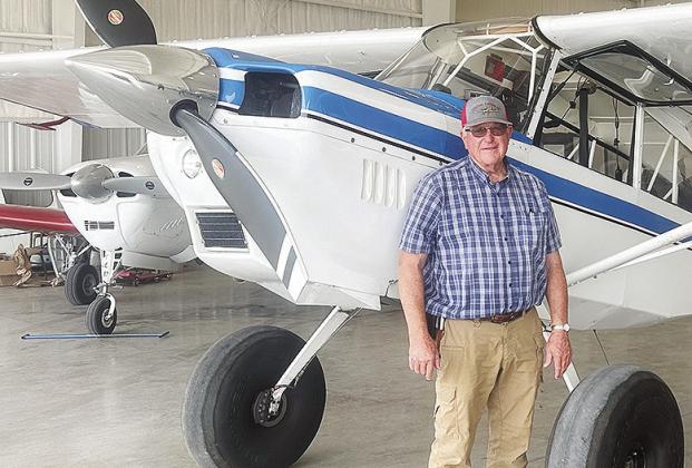 Greg Little from Carnegie, stands next to one of his aircraft being housed at the Clinton Regional Airport. CDN | Shiann Dawson