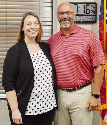 Newly-hired Asst. Supt. Melissa Knabe, left, and Supt. Nathan Meget pose for a photo after she was approved Monday for the position. CDN | Micah Ashcraft