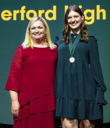 Krystal Moses, left, stands with honoree Katie Kreizenbeck during the 40th Academic All-State Awards Celebration. CDN | Courtesy photo