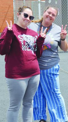 Teachers Gabby Paul, left, and Kenzie Medina are out in the sun during recess duty at Southwest Elementary School. CDN | Christian Jacobsen