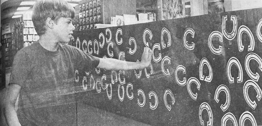 40 YEARS AGO Richie Waddle, 10-year-old son of Mike and Deloris Waddle, checked out his progress in the Clinton Public Library’s Summer Reading Program. Any youngster to get 10 horseshoes on the board got a certificate.