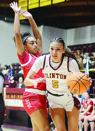 No. 5 Lillian Lime drives by a Cache defender Tuesday during Clinton’s home win over the Lady Bulldogs. CDN | Sam Goodwyn