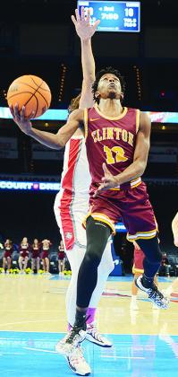 No. 12 Atticus Thompson goes up for the layup during Clinton’s “Court of Dreams” game against Cache. CDN | Sam Goodwyn