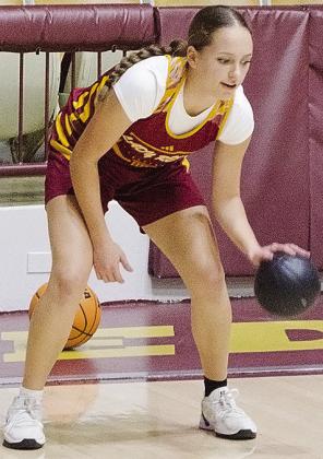 Clinton’s Paisley Ruyle practices her dribbling skills during practice Wednesday in the Tornado Dome. CDN | Sam Goodwyn