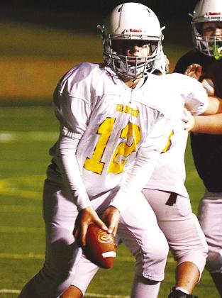 No. 12 Jance Baker tosses the ball to his running back during their Clinton Next League game in the Tornado Bowl. CDN | Sam Goodwyn