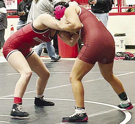 Clinton’s Angelina Ramirez, right, grapples with her opponent during the Class 5A girls’ wrestling tournament Monday in Cache. CDN | Courtesy Photo